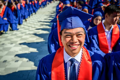 Student looking into distance at graduation ceremony