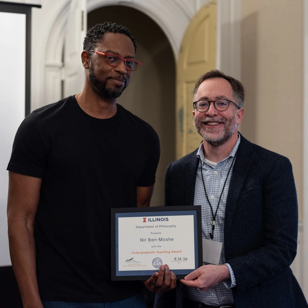 Department head Luvell Anderson presents professor Nir Ben-Moshe with the Excellence in Undergraduate Teaching Award